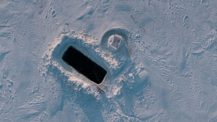 drone shot of an empty ice hole