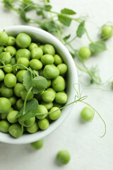 Bowl with fresh pea seeds, close up