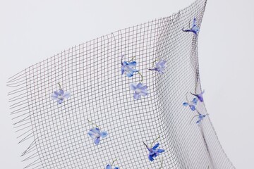 Blue flowers on mesh fabric

