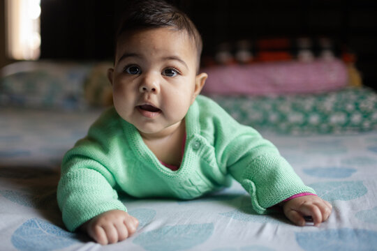 Cute baby girl looking at camera