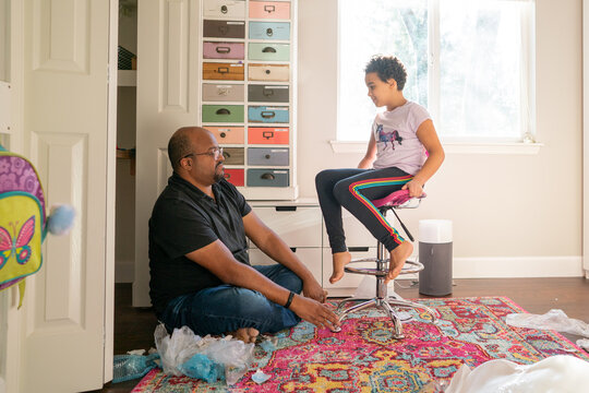 Girl sits in newly assembled chair