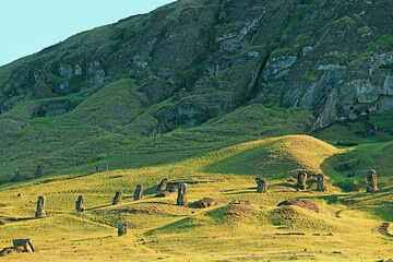 Large group of abandoned gigantic Moai statues on the slope of Rano Raraku volcano, the legendary...
