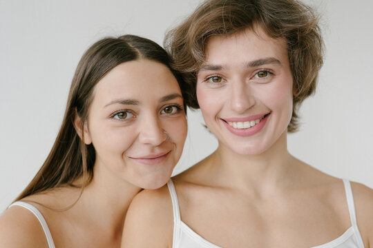 Happy women with different hairstyle looking at camera