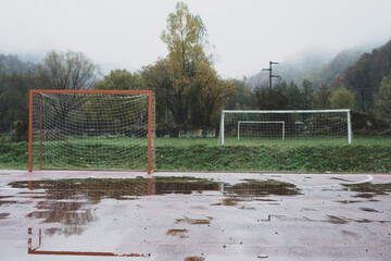 Empty football gates after rain.