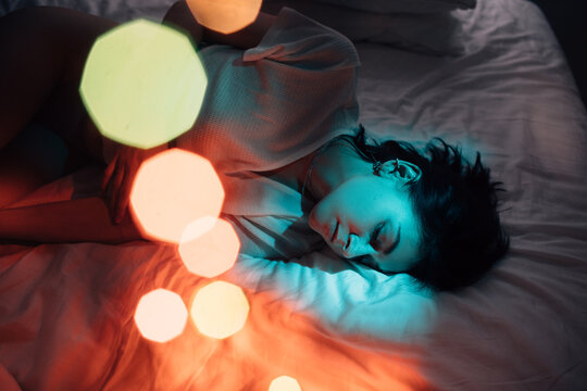 Woman relaxing on comfortable bed