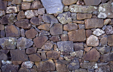 Close up detail of patterns and textures of a drystone rock wall
