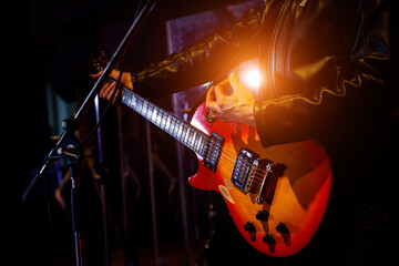 Fototapeta na wymiar Guitar during a concert. Guitarist on stage.