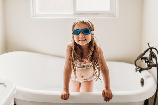 Girl with goggles enjoying bath