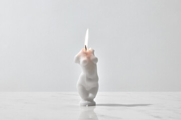 Female shaped candle with flame