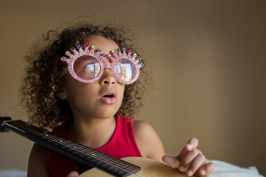 Singing girl with novelty glasses