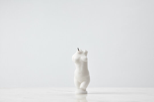Candle in shape of female body