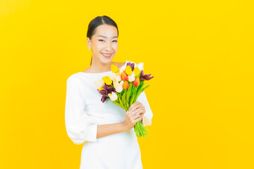 Portrait beautiful young asian woman smile with flower