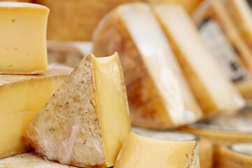 Sheep cheese in a street market in Barcelona (Spain), food concept.