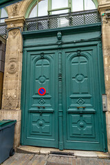 French front door in blue green color solid old wood