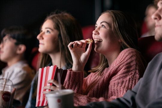 Movies: Girl Laughs While Eating Popcorn During Movie