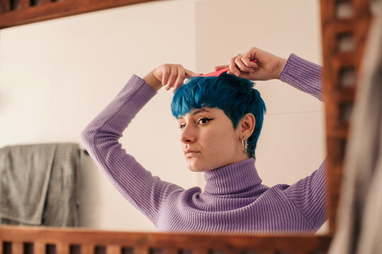 Real woman styling her hair