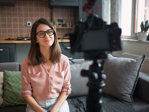 Woman recording video at home