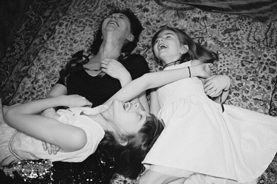Monochrome, home portrait of a beautiful, happy family 