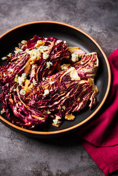 Close Up of Bowl of Roasted Radicchio with Pecans and Blue Cheese