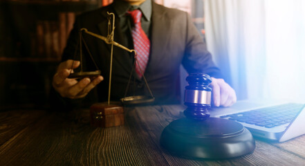 Business and lawyers discussing contract papers with brass scale on desk in office. Law, legal...