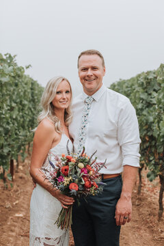 Smiling Bride and Groom in Vineyard
