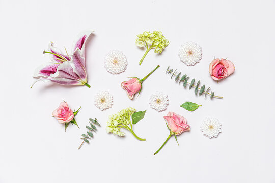 Flowers assembled on pale pink background