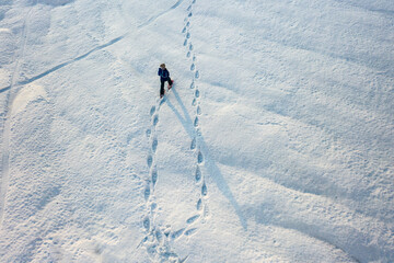 person walking with snowshoes