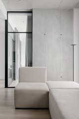 Fototapeta na wymiar Stylish furniture in light room in studio flat