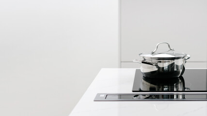 Fancy glass induction stove with metal pot