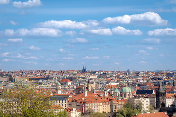 Fototapeta na wymiar Prague cityscape - shot taken from Prague castle overlooking part of Charles Bridge and Old Town and New Town