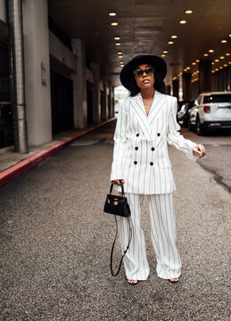 Stroll in the city in black and white suit