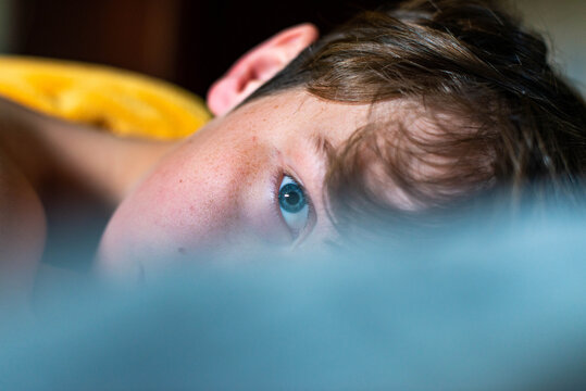 Boy Lazing in Bed