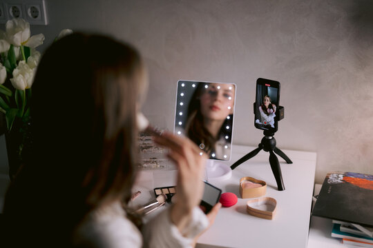 Beauty blogger doing makeup for blog 