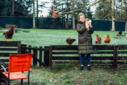 Woman Holding Chicken