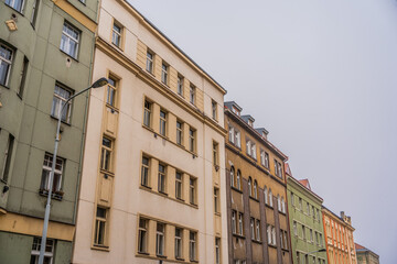 Fototapeta na wymiar Row of old apartments buildings - late 19th and early 20th century - on Krasova street in the district of Zizkov, Prague, Czechia