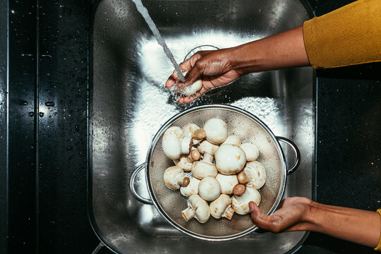 Woman Washing Mushrooms
