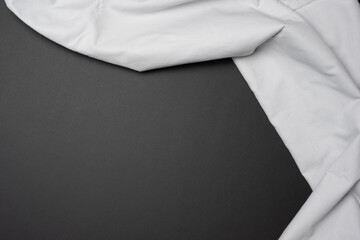 Neutral white grey cloth on a large black bacground for flag and graphics overlay and displacement map designs