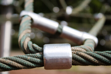 Close up of a knot on rope climbing frame in playground