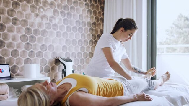 Senior woman on physiotherapy in resort.