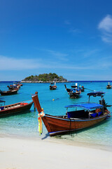 Naklejka na ściany i meble long tail boat, in white sand beach in the andaman sea