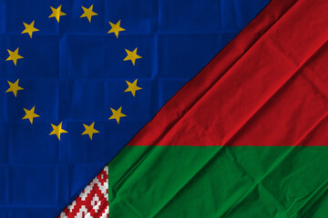 Concept of the relationship between the European Union (EU) and Belarus with two flags over each other