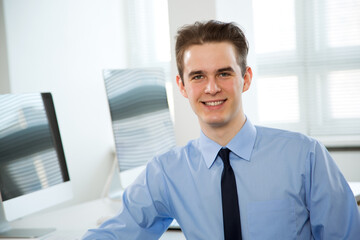 Portrait of young businessman at office