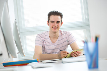 Portrait of young student in a computer class