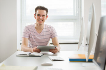 Portrait of young student in a computer class