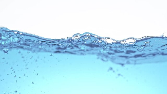 Super Slow Motion Shot of Clear Waving Water With Bubbles Background at 1000 fps.
