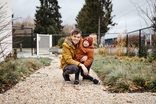Dad and son together in the garden