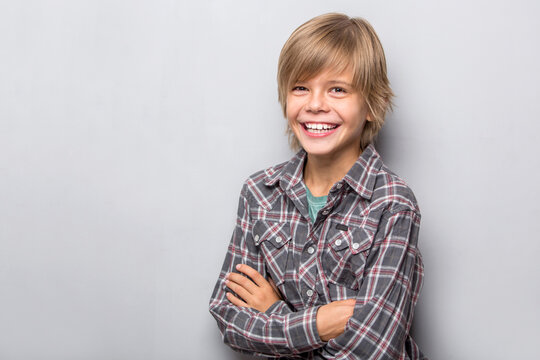 young teenager boy smiling isolated on white background