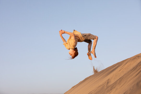 Boy back flipping