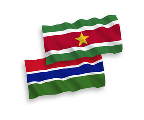 Flags of Republic of Suriname and Republic of Gambia on a white background