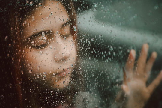 Girl and Wet Window